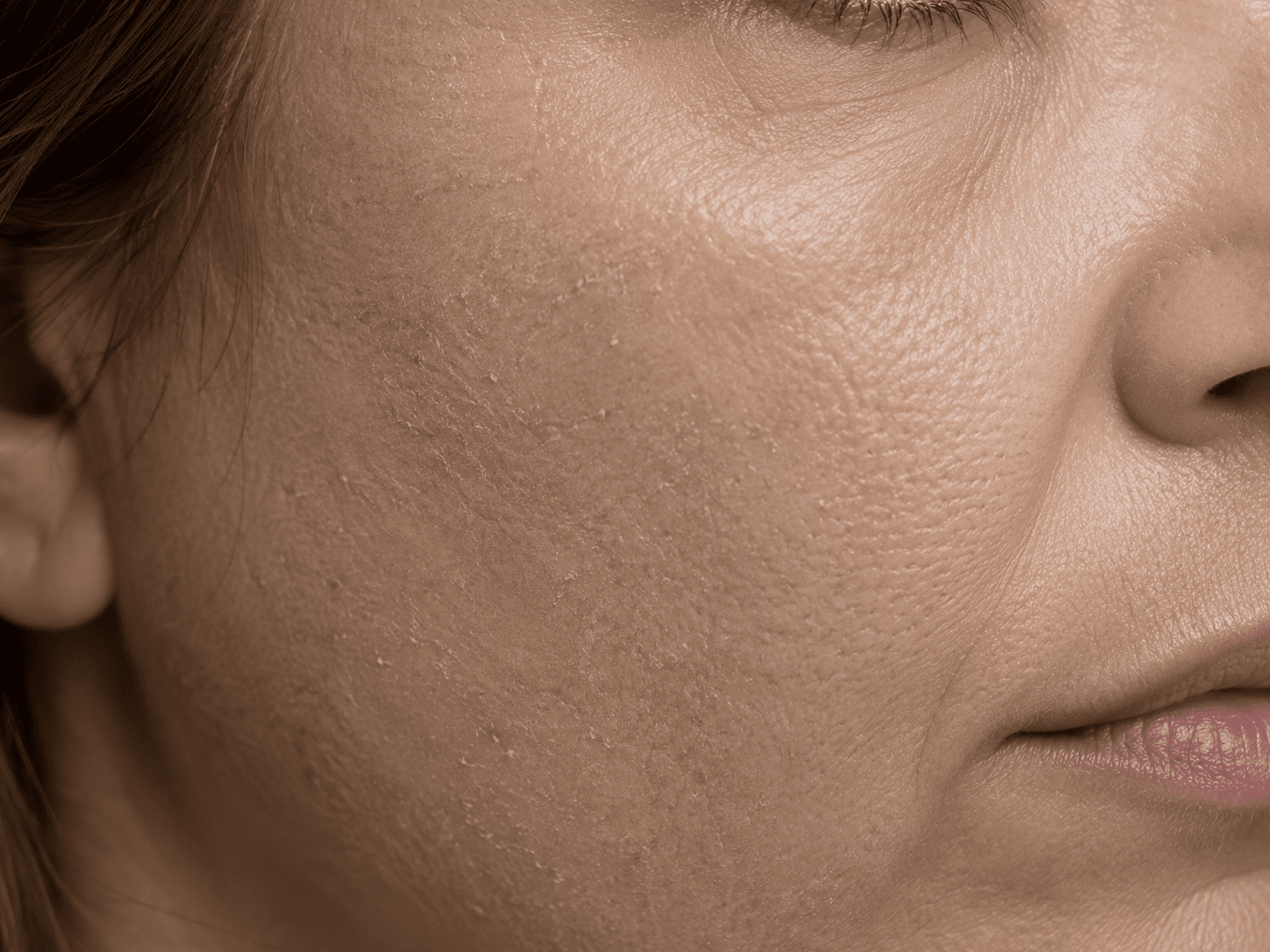 Naturally radiant skin in soft morning light, evoking healthy glow